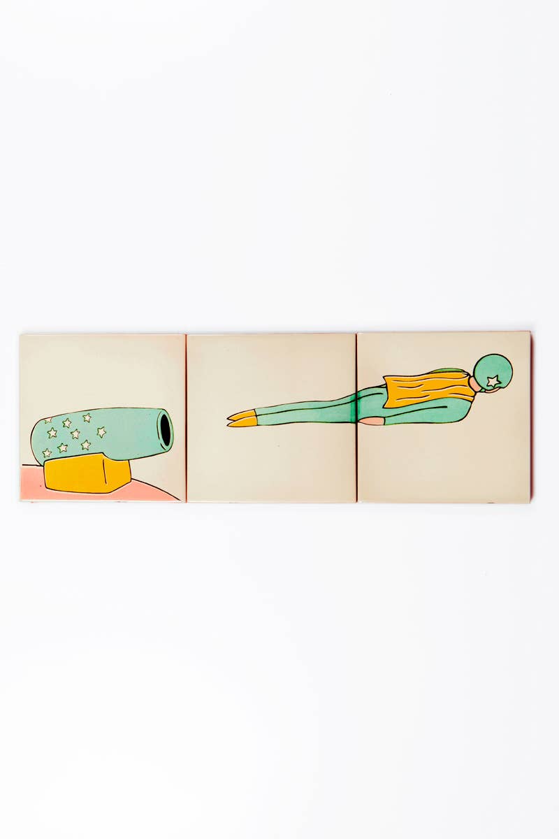 The Bussoga Self Adhesive Wall Mural 3 Tiles, Bullet Man, features an illustrated figure in a green suit and helmet launched from a starry cannon, flying with arms by their side and a yellow scarf streaming behind.