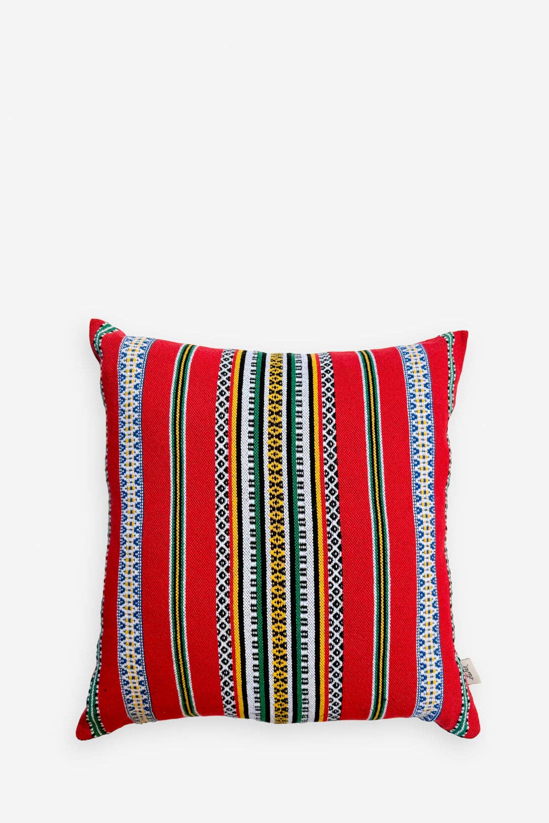 The Eturel Madrid Red Pomegranate Cushion Cover (50cmx45cm) features a vibrant red base with multicolored vertical stripes and geometric patterns. This handmade Spanish design is shown against a plain white background.