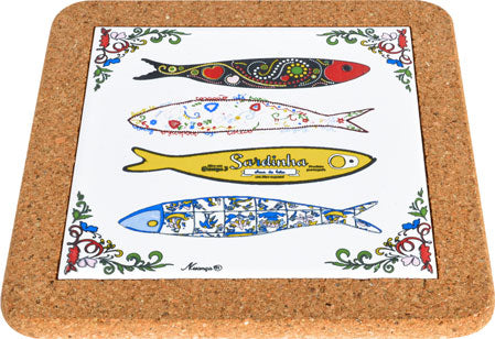 The Trivet Sardines by Barcelos Imports features four colorful, stylized sardines on a white cork-backed surface with floral corner accents—a charming Portuguese fish-inspired addition to your kitchen.