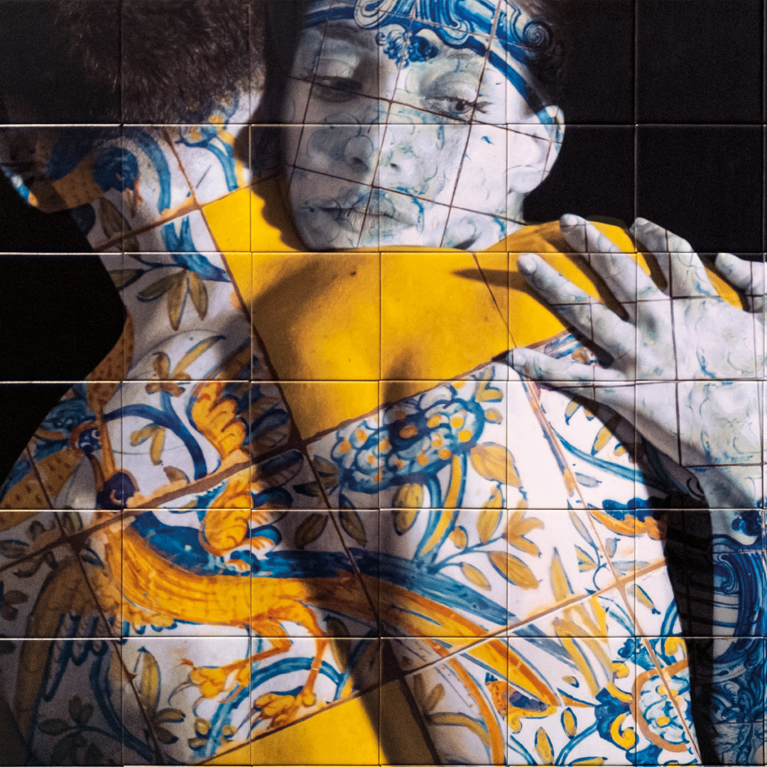 Artistic depiction of a woman holding a yellow box with intricate patterns on a dark background