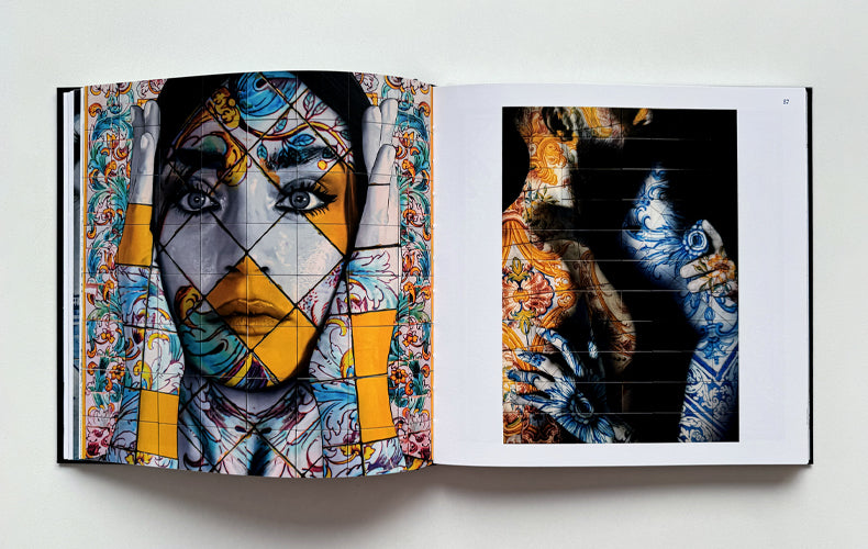Open book displaying artistic illustrations of a face and hands on a white background