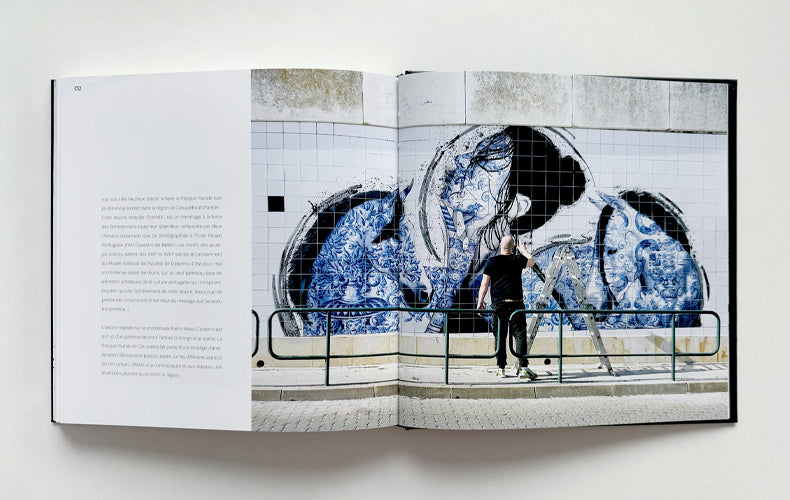 Open book showing a page with text and an artistic illustration of a person with horses.