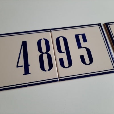 TilePassion’s Handpainted Ceramic Door Numbers – Custom Portuguese Tiles in white with blue borders display 4895, shown as two rectangular tiles (4 and 8, 9 and 5) against a plain white background.