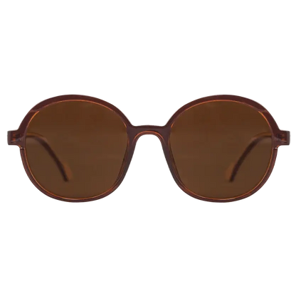 Oceanides Brisa Crystal Brown Beige Sunglasses feature oversize round frames with dark brown lenses, shown front-facing on a plain white background—a stylish 80s-inspired accessory for fashion enthusiasts.