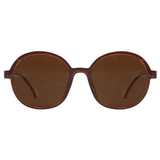 Oceanides Brisa Crystal Brown Beige Sunglasses feature oversize round frames with dark brown lenses, shown front-facing on a plain white background—a stylish 80s-inspired accessory for fashion enthusiasts.