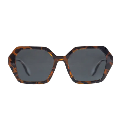 The Oceanides Coral Dark Havana Sunglasses feature an oversized geometric design with a tortoiseshell brown and black acetate frame and dark grey polarized lenses, shown front-facing against a white background.