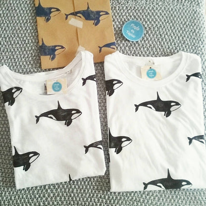 Close-up of the hand block-printed orca design created with eco-friendly inks on premium cotton.