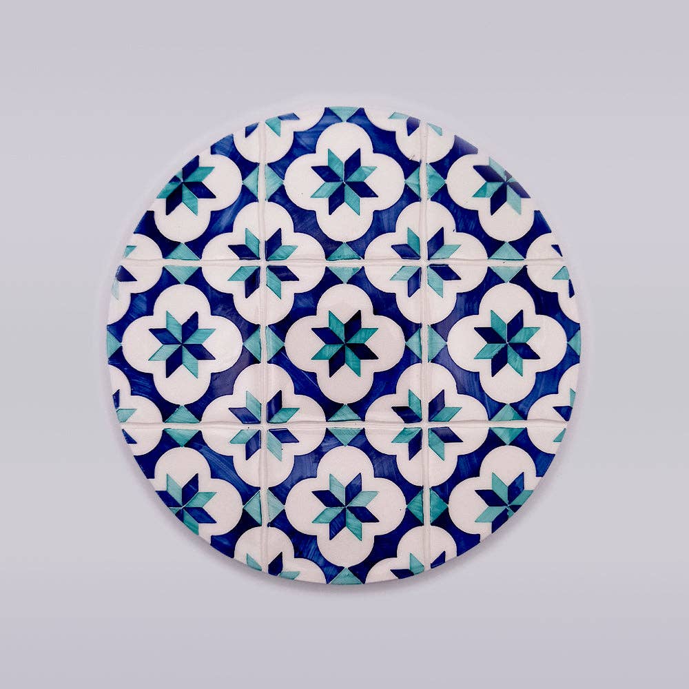 ceramic trivet with blue and green motif