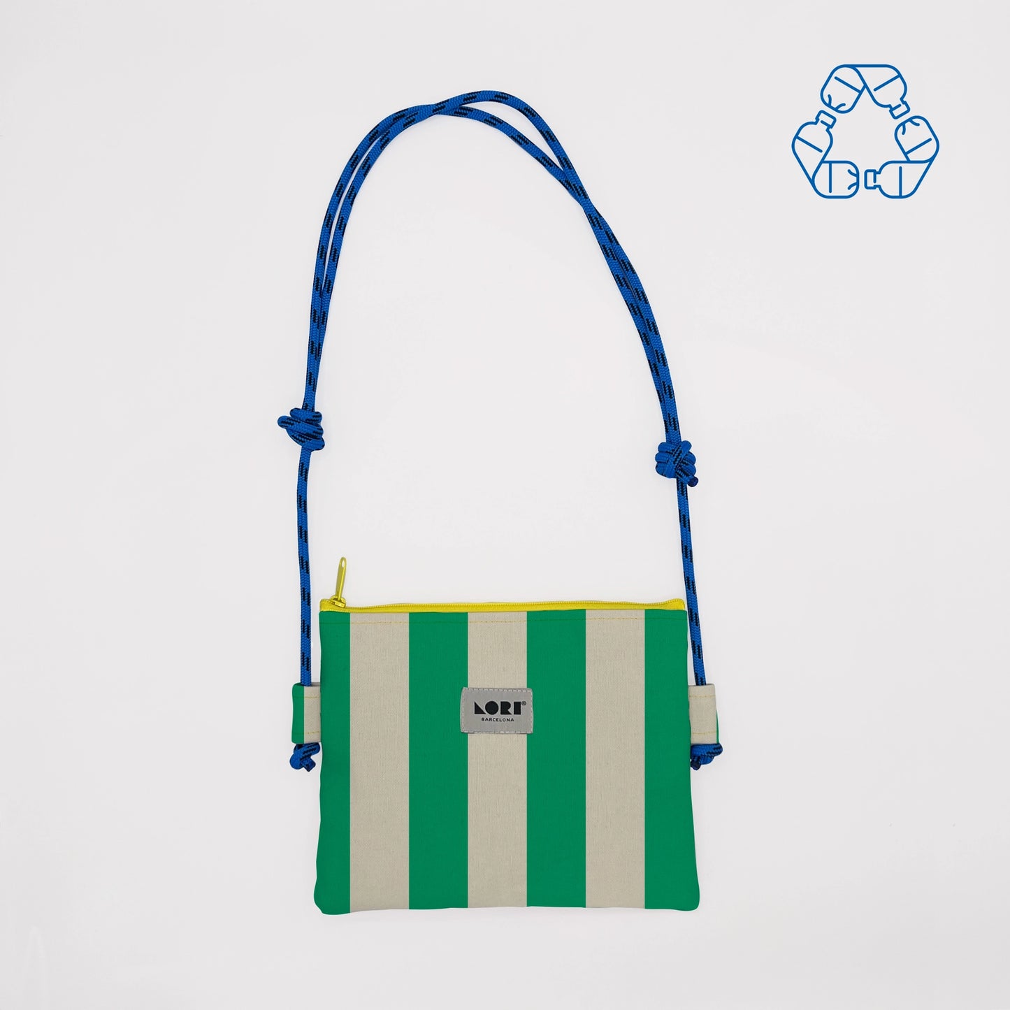 A small crossbody bag with vertical green and cream stripes, a blue braided shoulder strap, and a yellow zipper, shown on a light gray background with a blue recycling icon in the top right corner.