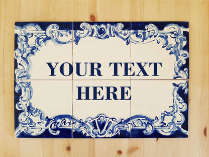 The TilePassion Bespoke Outdoor House Address Portuguese Tile Mural in Cobalt Blue is a hand-painted ceramic sign with blue floral borders, set on wood, featuring a customizable blank center for your address text.