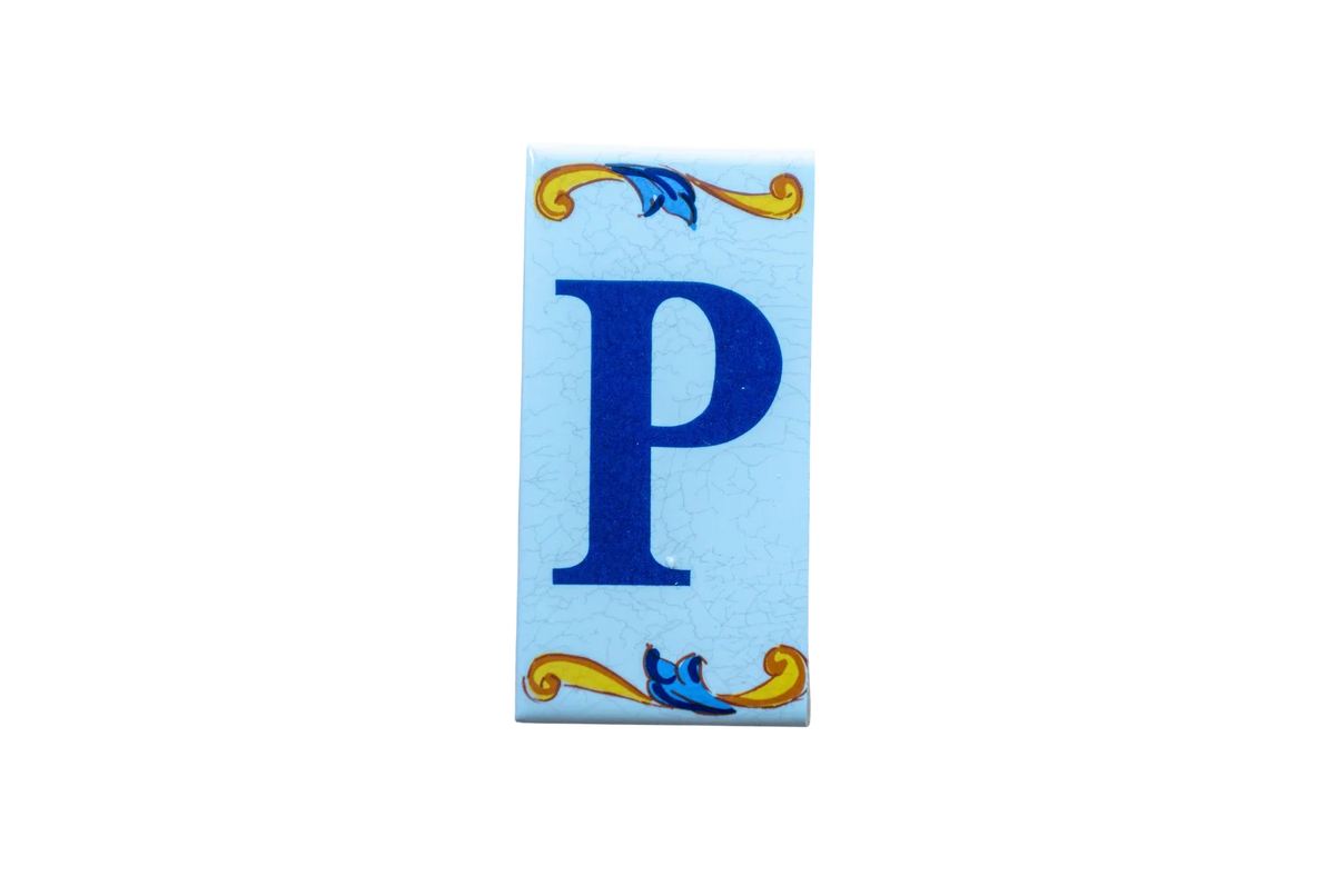 Lisa Croquets Letters – Ceramic House Letter Tiles featuring a blue letter P with blue and gold decorative flourishes at the top and bottom.