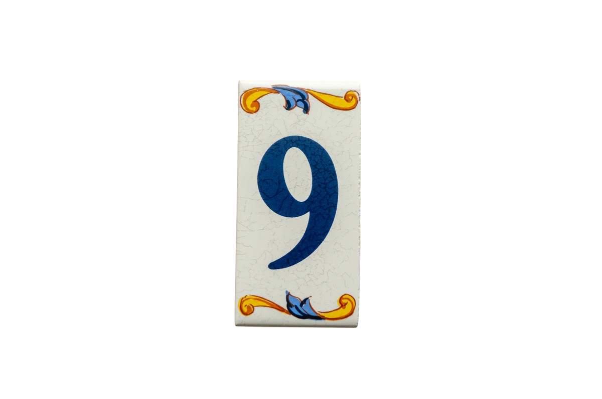 Lisa Croquets Numbers – Ceramic House Number Tile in a rectangular Mediterranean style, featuring the number nine in blue with yellow and blue floral scrollwork at the top and bottom.