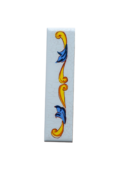 Lisa Croquets Numbers – Ceramic House Number Tiles, a rectangular white ceramic tile with a crackled finish and a vertical decorative border of yellow scrolls and blue leaves, handcrafted in Spain.