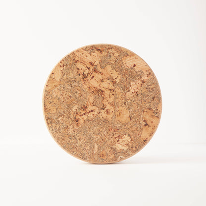 The LIGA Natural Cork Trivet - Round Small is shown upright on a plain white background, featuring a textured surface that highlights its eco sustainable homeware design and heat-resistant properties.