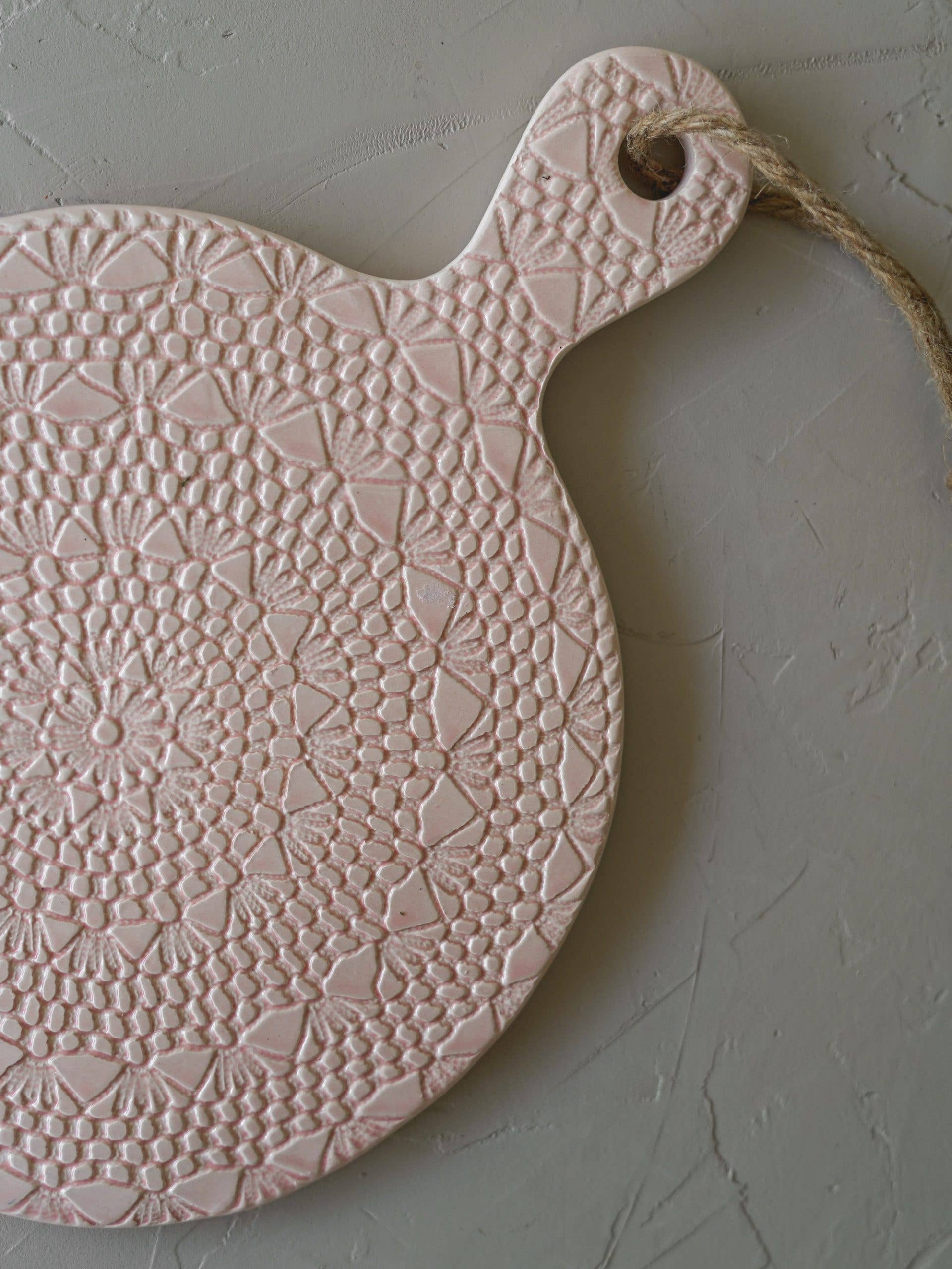 LIght pink ceramic crochet board with 